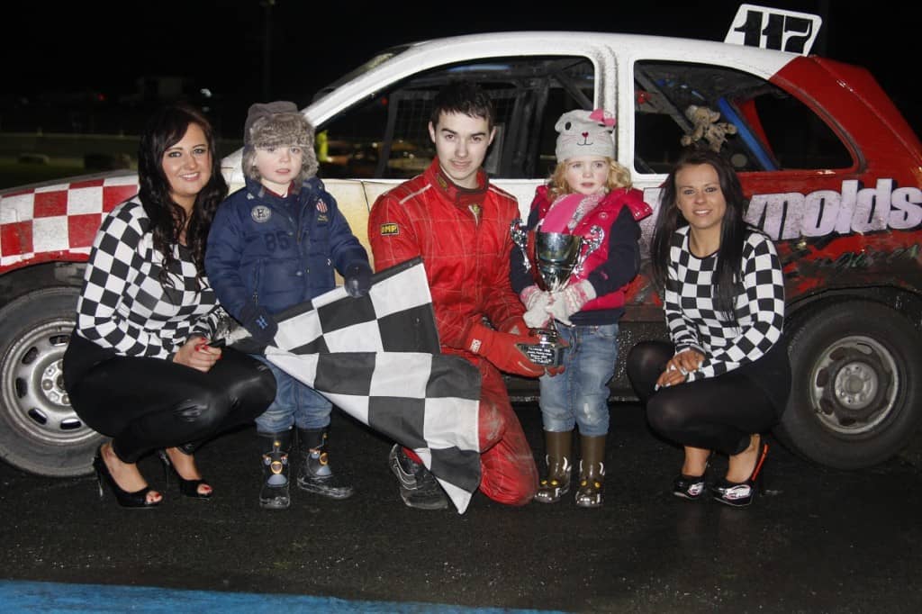 Teenage sensation Edmund Davis took the final honours in the Junior Productions at Tullyroan Oval. Here he is presented wioth the Cirrus Plastics trophy by Callum and Jessica Doak, as Tullyroan girls Paula and Haley look on.