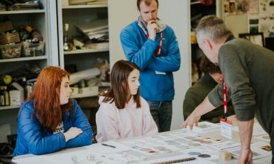 Students from Southern Regional College working on a creative project with inspiration from Alleyways artists Kevin Killen and Robert Peters