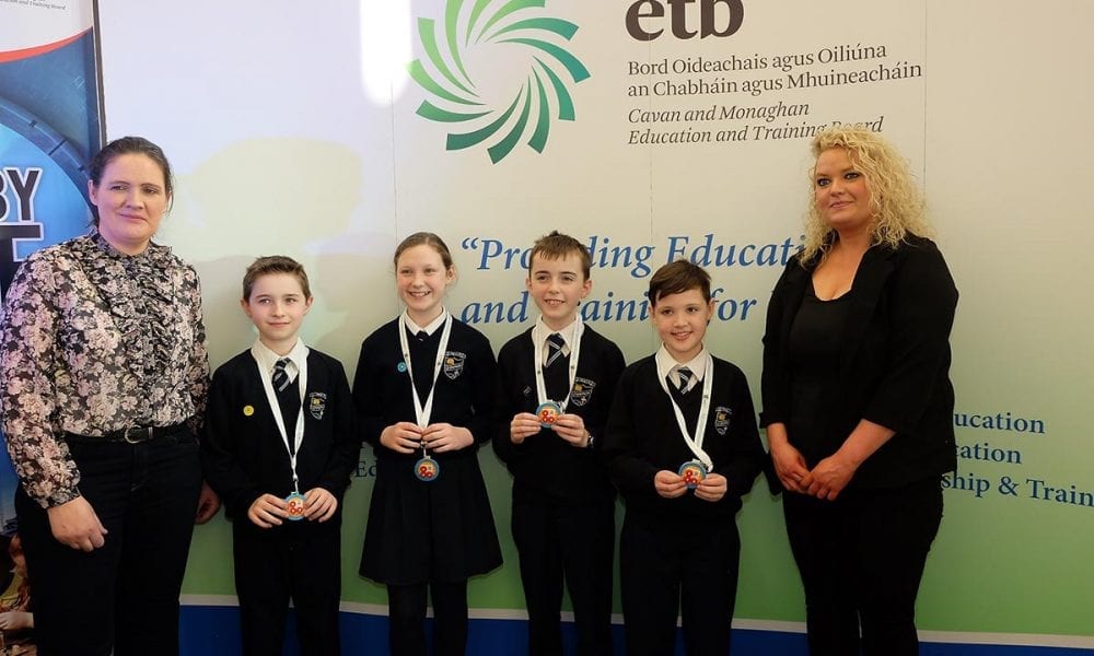 St Mary's Primary School Students receive their medals from Laura Brady Project Co ordinator CMETB