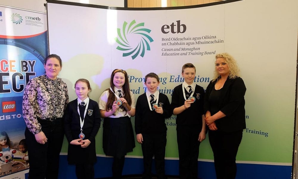 St Mary's Primary School Students receive their medals from Laura Brady Project Co ordinator CMETB