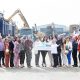 Michelle OHare, Gareth Tinnelly and members of the Tinnelly Group Lottery Syndicate celebrate their £253,489.30 EuroMillions win at the demolition companys headquarters in Newry.