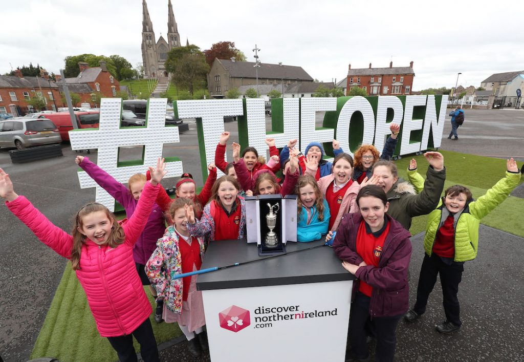 ‘The Epic Journey to The 148th Open’ The Epic Journey to The 148th Open Swings into Armagh – Local Armagh schools, golf clubs, tourism industry representatives and sports stars joined together at The Shambles Yard to celebrate Tourism NI’s community engagement campaign ‘The Epic Journey to The 148th Open’. The community event is visiting every county in NI to mark the excitement and civic pride surrounding The Open Championship’s return to Royal Portrush this July. 