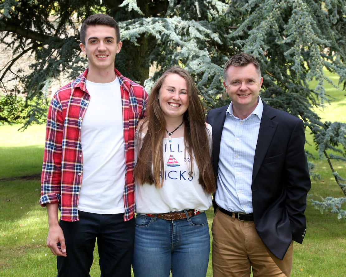 The Headmaster, Mr Montgomery, congratulates Head Boy Kyle Magwood and Head Girl Laura Hampton on their outstanding A Level results