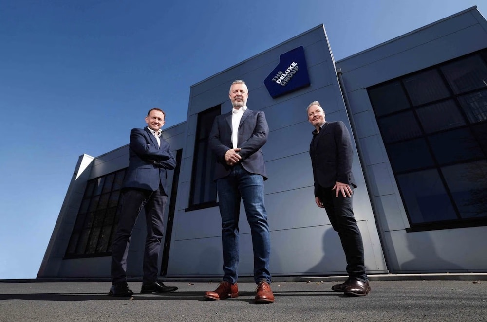 Deluxe Group director Colm Connolly (left) with fellow director Colm O’Farrell and executive chairman Richard Hill. Photograph- Kelvin Boyles