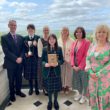 Pupils and staff from St Catherine's College, Armagh being presented with the Derrytrasna pastoral care award by the Permanent Secretary of the Department of Education, Dr Mark Browne and Director of Public Health, Public Health Agency Dr Joanne McClean