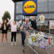 Lurgan Store Manager Simon Magowan with winner Brian McAclinden and daughter Maisy