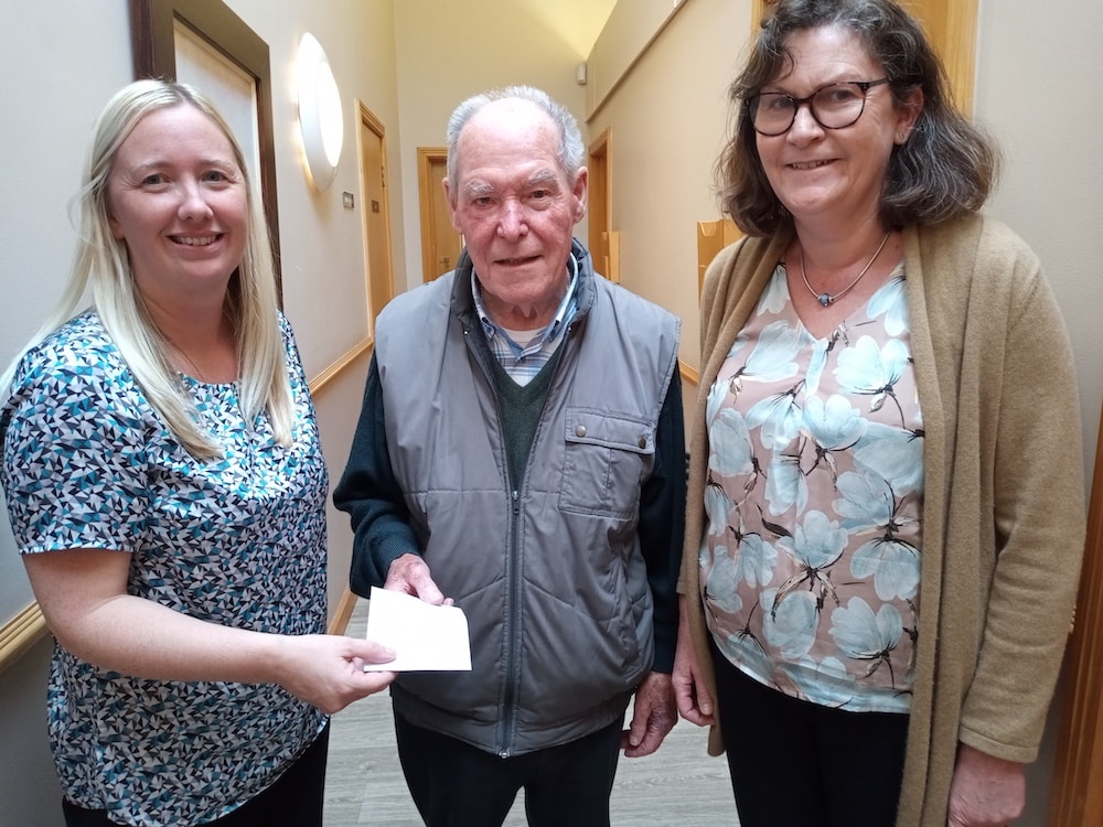 Clare and Dr Gillian Nicholson receiving the cheque on behalf of Abbey Court Surgery with Mr Lennon