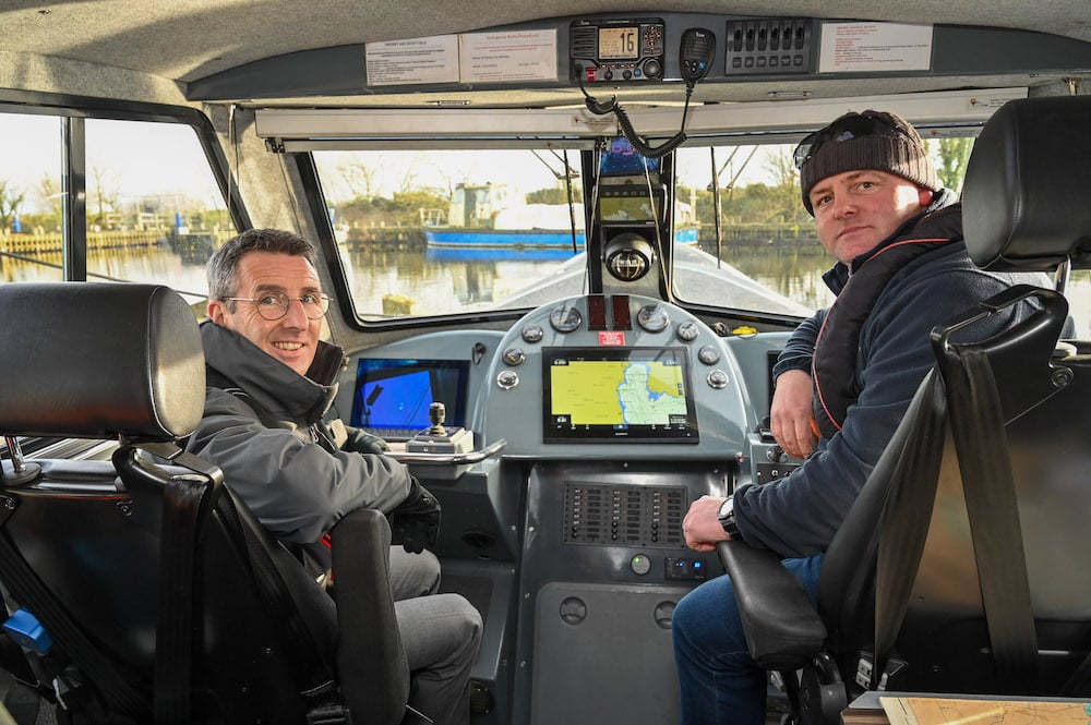 DAERA Minister Andrew Muir (left) takes a boat trip across Lough Neagh with Skipper and Fisheries Officer Eoin McFadden